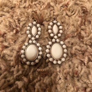 White dangle earrings